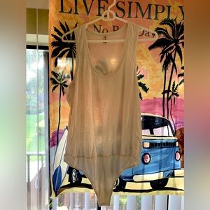 Free people -color creamish -white bodysuit -size large for sale(runs bigger).